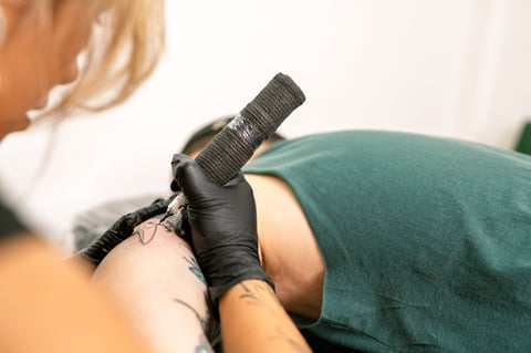 Applying new tattoo design