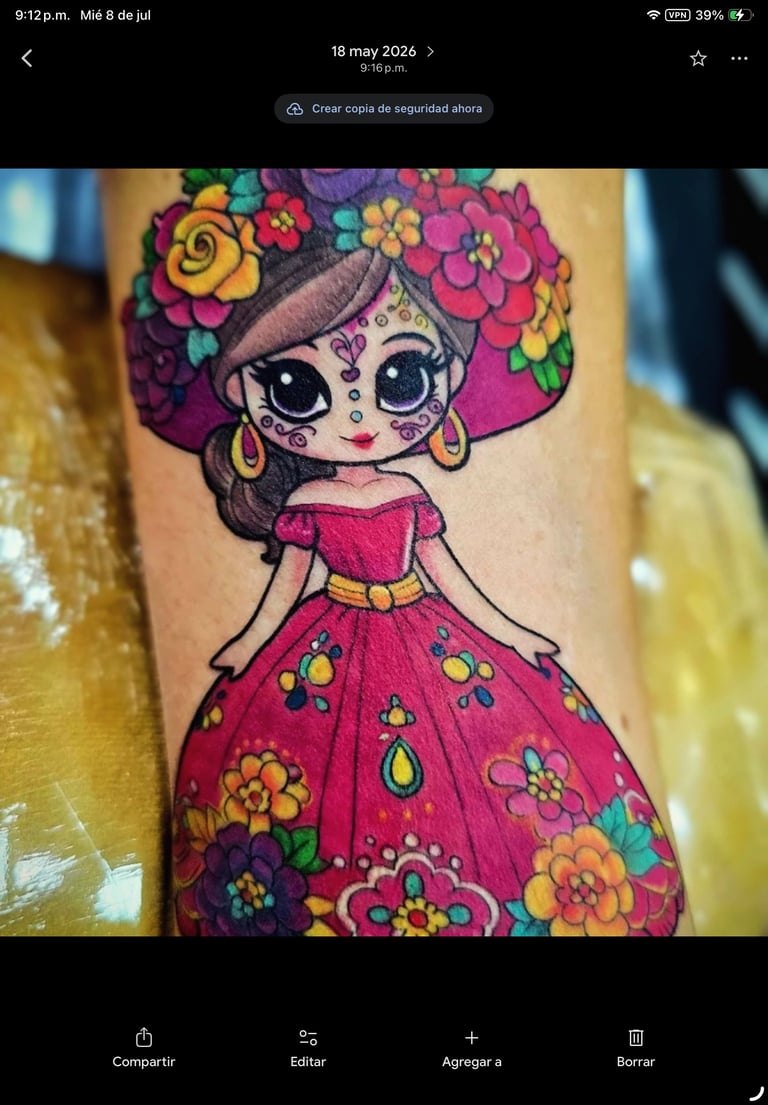 Colorful tattoo of a young girl with large eyes, flower crown, and vibrant pink dress with floral patterns on arm